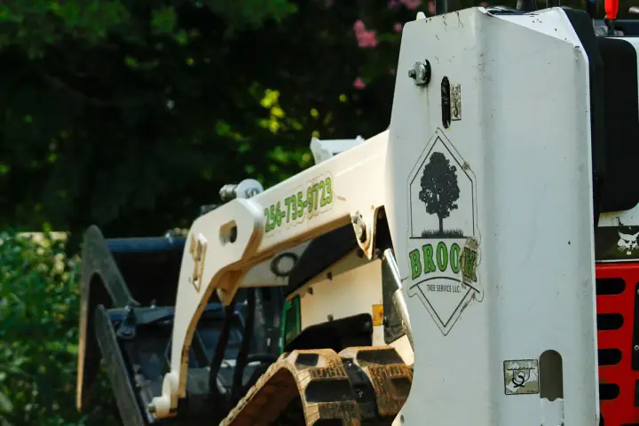 Brook Tree Service branded equipment working a job site in Cullman County